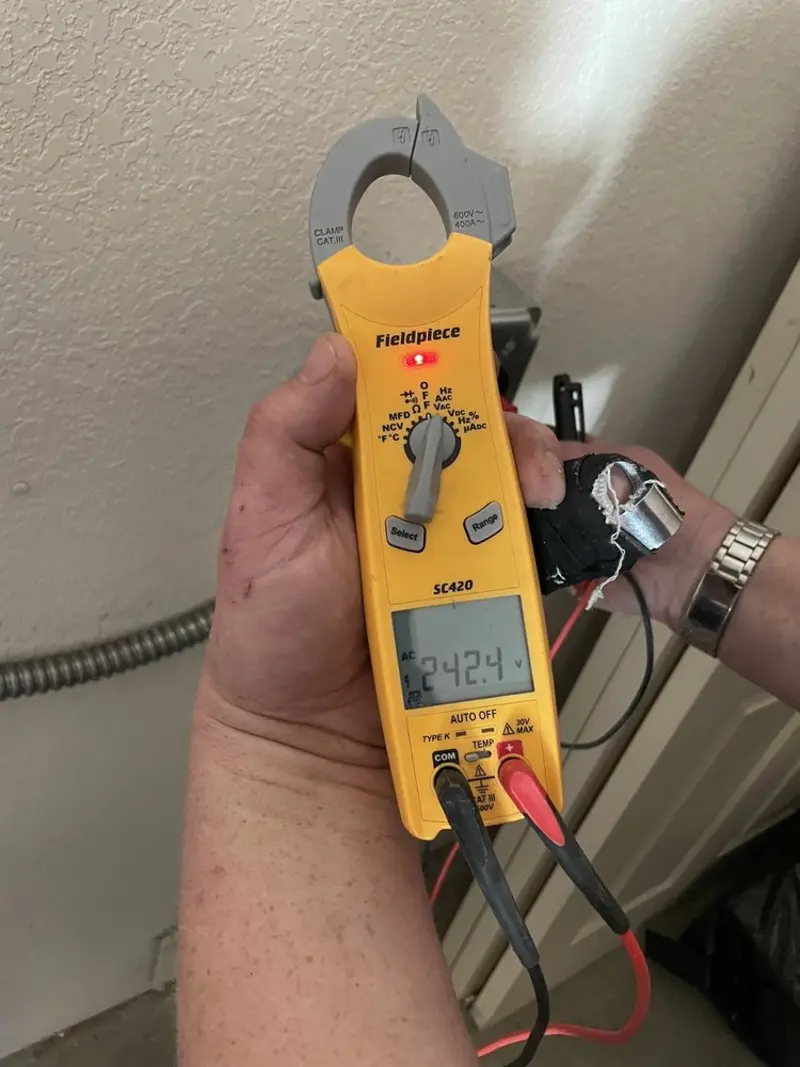 Voltage testing with clamp meter during Ceiling Fan Installation in Fort Walton Beach